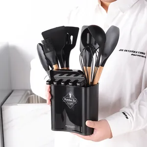 12-piece silicone kitchen utensil set with wooden handles and black storage bucket