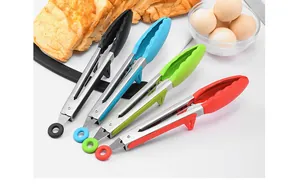 Close-up of colorful silicone and stainless steel tongs arrayed for BBQ and kitchen use.