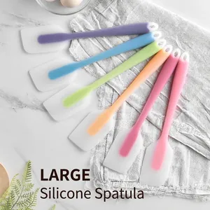 Set of six colorful semitransparent silicone spatulas for baking and cream mixing.