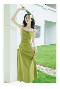 Elegant French style green midi slip dress featuring pearl straps and a chic cowl neck design