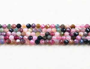 Close-up of faceted multi-colored tourmaline beads for DIY jewelry making.