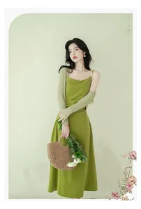 Elegant French style green slip dress with matching knitted arm covers for summer.