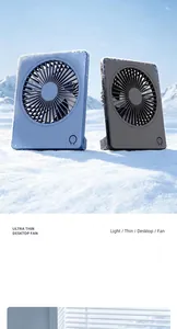 Ultra-thin portable USB desktop fan shown in blue and black colors on snowy background