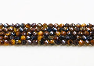 Macro detail of faceted yellow tiger eye stone beads showing natural texture