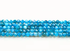 Macro detail of blue faceted apatite round beads for DIY jewelry making and accessories