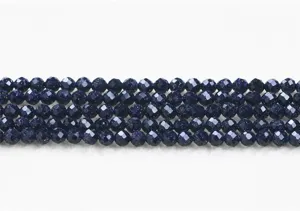Close-up of faceted synthetic blue goldstone beads for jewelry making