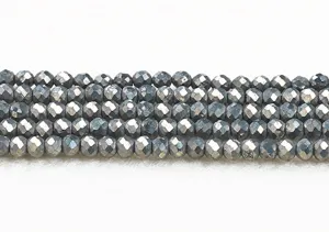 Close-up of faceted pyrite round beads showing metallic luster for DIY jewelry