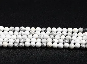 Close-up of faceted white howlite beads for DIY jewelry making accessories
