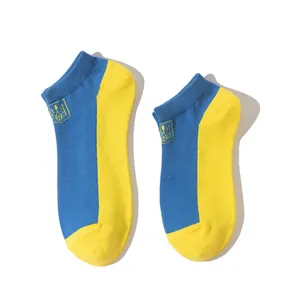 Close-up of low-cut socks featuring the blue and yellow colors of the Ukrainian flag