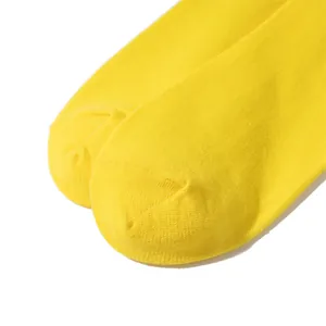 Detailed close-up of the toe area on a pair of bright yellow cotton socks.