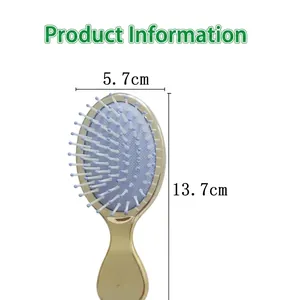 Mini portable air cushion hairbrush with gold-plated handle and blue-tipped bristles