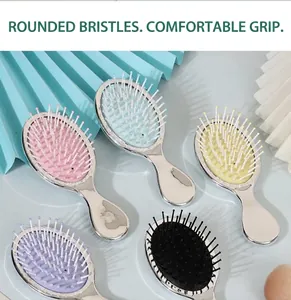 Macro detail of colorful mini electroplated cushion hair brushes for scalp massage