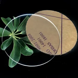 Clear circular acrylic disc with brown protective paper film and smooth laser-cut edges