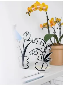 Detailed macro view of Daily Flower acrylic memo stand with elegant floral line art