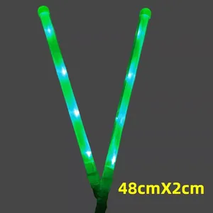 Close-up detail of green LED glow stick featuring 48cm x 2cm dimensions for parties
