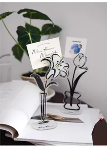 Acrylic flower memo holder clip detail with clear stand for desktop message display