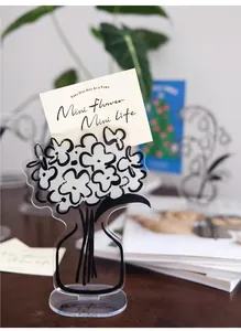 Close-up of acrylic floral message stand with Daily Flower engraving and card slot