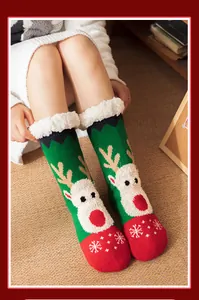 Close-up of cozy Christmas reindeer floor socks with thick white fleece lining.