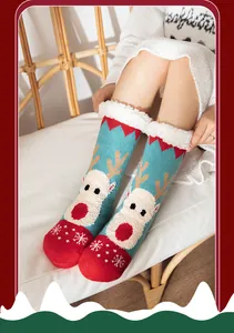 Detail view of cozy fuzzy Christmas socks featuring a reindeer pattern and warm sherpa lining