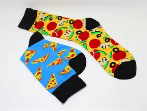 Detail shot of mismatched pizza patterned cotton socks featuring vibrant blue and yellow colors