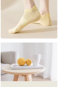 Detailed view of yellow cotton ankle socks with breathable mesh for summer wear