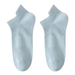 Pair of light blue breathable cotton low-cut ankle socks for women on white background