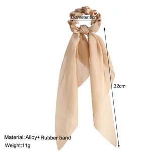 Dimensions and material details for this champagne satin ribbon bow scrunchie hair tie