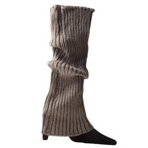 Close-up of grey ribbed knitted leg warmers featuring a soft slouchy texture for ballet dance