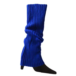 Close-up of vibrant blue knitted leg warmers showing ribbed texture details