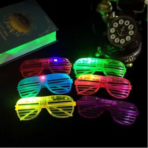 Detailed view of six colorful LED shutter glasses glowing brightly in a dark setting