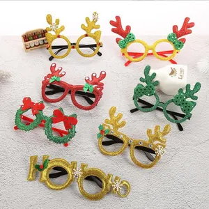 Variety of glittery Christmas novelty glasses with reindeer antlers and wreath designs.