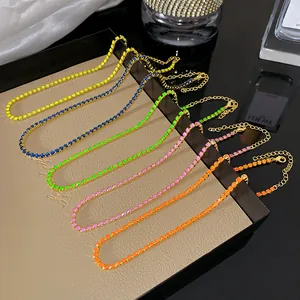 Close-up detail of colorful zircon crystal tennis necklaces with gold-tone alloy chains