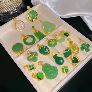 Collection of Chinese style green jade-style pendants with gold-plated settings