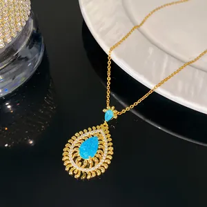 Macro view of luxury vintage sleeping beauty turquoise teardrop necklace in gold finish