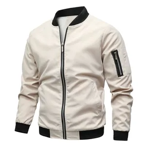 Detail shot of men's beige bomber jacket with black ribbed collar and sleeve zipper pocket
