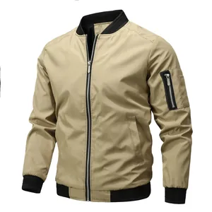 Front view of khaki men's bomber jacket with black ribbed trim and sleeve zipper pocket