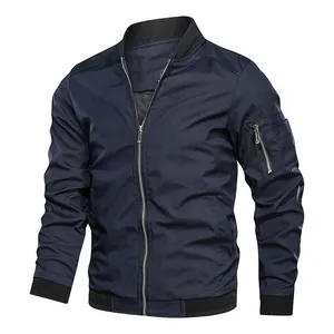 Detailed view of a navy blue men's bomber jacket with ribbed collar and sleeve pocket.