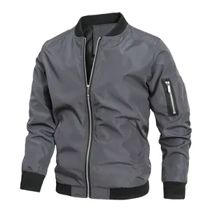 Detailed view of dark gray men's bomber jacket with sleeve pocket and black ribbed trim