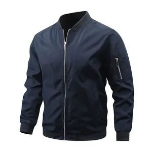 Detailed view of navy blue men's bomber jacket featuring ribbed collar and arm zipper.