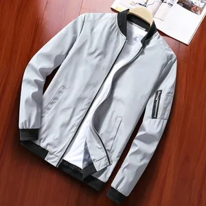 Light grey men's business casual bomber jacket with black ribbed collar and sleeve zipper