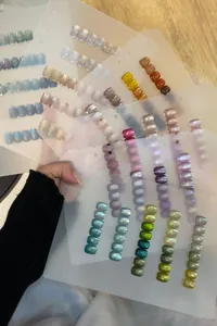 Detailed macro swatches of high-density glass bead cat-eye nail polish in vibrant colors