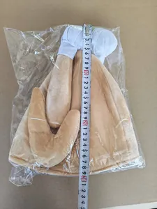 Plush Thanksgiving turkey leg hat with LED light being measured for size accuracy