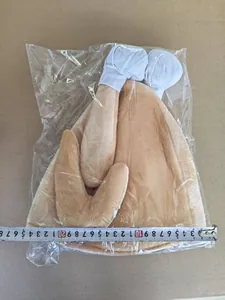 Detail of plush Thanksgiving turkey hat measured with tape for size accuracy.