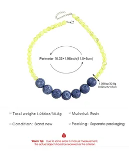Detail view of yellow and blue resin bead necklace with measurements and specs
