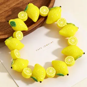 Vibrant yellow acrylic lemon beaded bracelet with realistic fruit slice charms