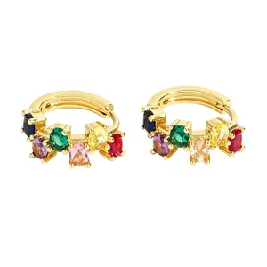 Detailed macro shot of gold-plated hoop earrings with multi-colored oval zircon stones