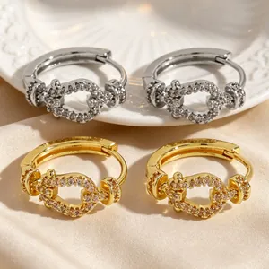 Detail view showing gold and silver vintage style hoop earrings with sparkling zircon stones
