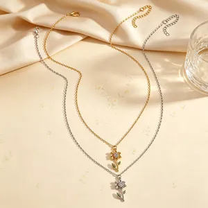 Detailansicht eleganter Sonnenblumen-Halsketten mit Blumendesign in Gold und Silber