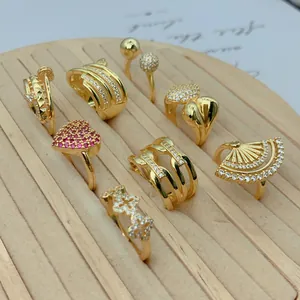 Selection of vintage gold-plated rings with zircon micro-pave in heart and fan shapes