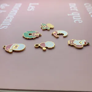 Close-up detail of various colorful Christmas themed enamel charms for DIY jewelry making